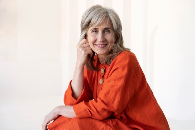 Free photo portrait of senior woman wearing red shirt