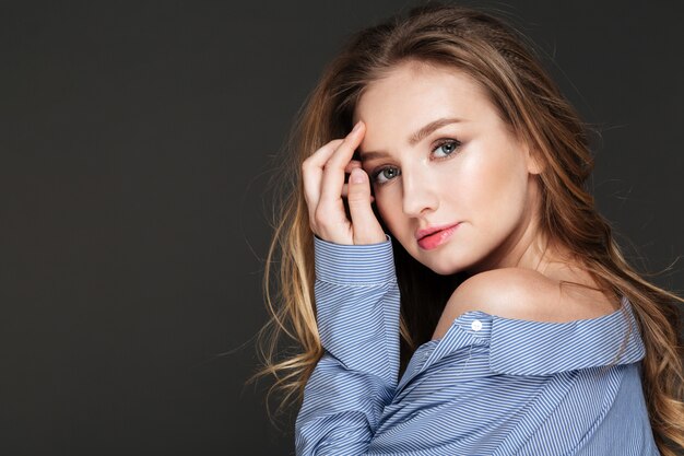 Portrait of sensual pretty young woman in striped shirt