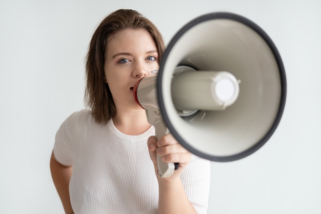 Portrait of serious female student attending meeting