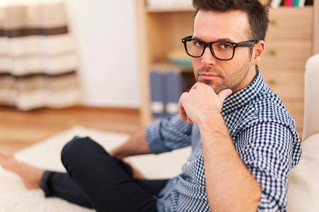 Portrait of serious man in domestic room