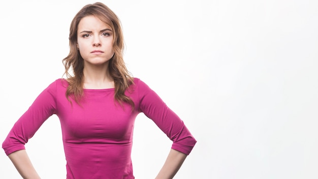 Portrait of a serious young woman over white background