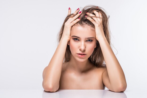 Portrait of sexy brunette model girl without clothes with fashion hairdo isolated on white background