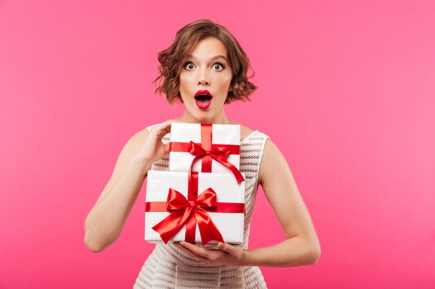 Portrait of a shocked girl dressed in dress