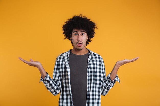 Portrait of a shocked young african man