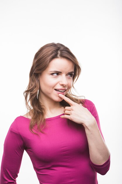 Portrait of a shy woman on white background