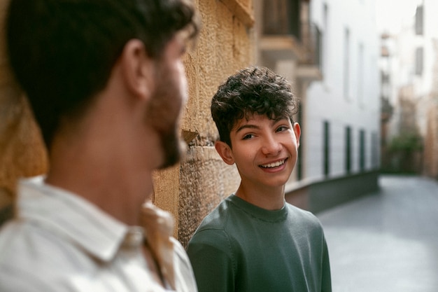 Free photo portrait of siblings outdoors for brothers day celebration