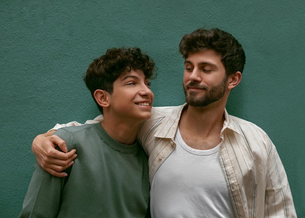 Free photo portrait of siblings outdoors for brothers day celebration