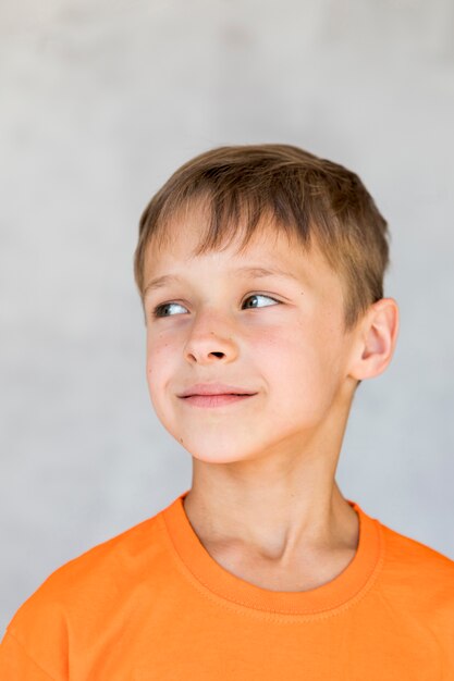 Portrait of smiley boy looking away