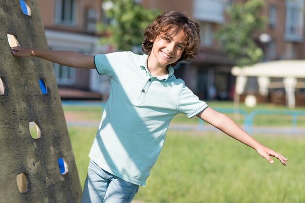 Free photo portrait smiley boy playing