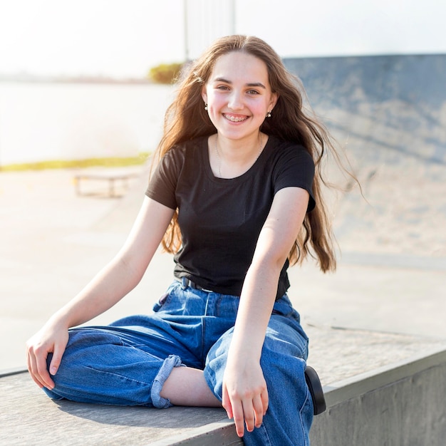 Portrait of smiley girl posing outdoors