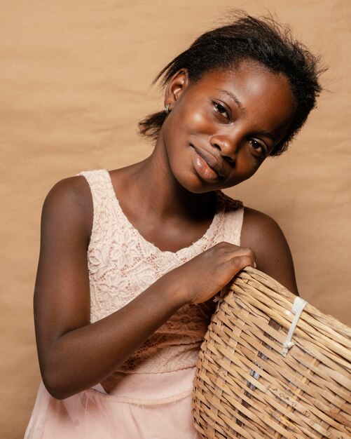 Portrait smiley girl with straw basket