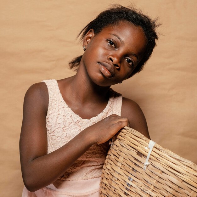 Portrait smiley girl with straw basket