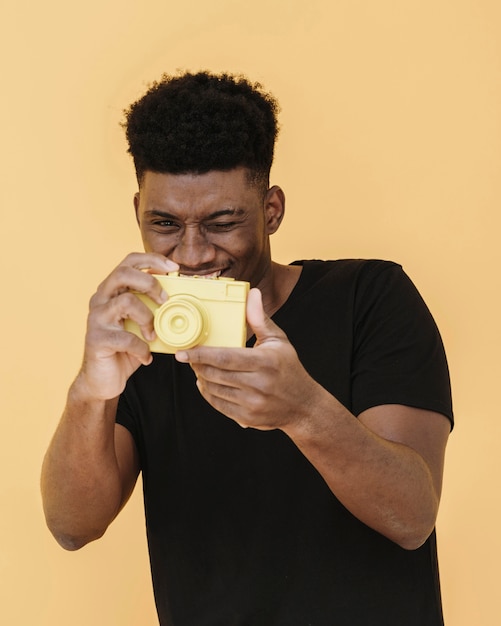 Portrait of smiley man with camera