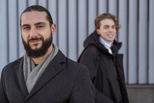 Portrait of smiley men posing outdoors