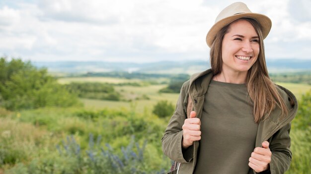 Portrait of smiley traveller posing outdoors