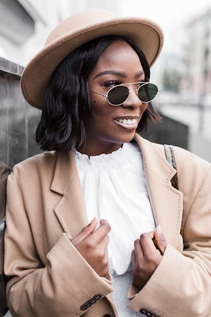 Free photo portrait of smiley woman looking away