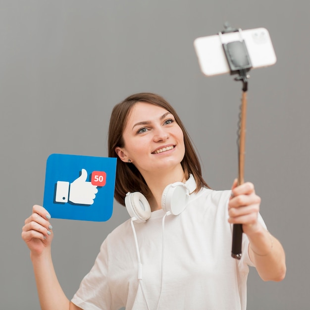 portrait of smiley woman recording herself