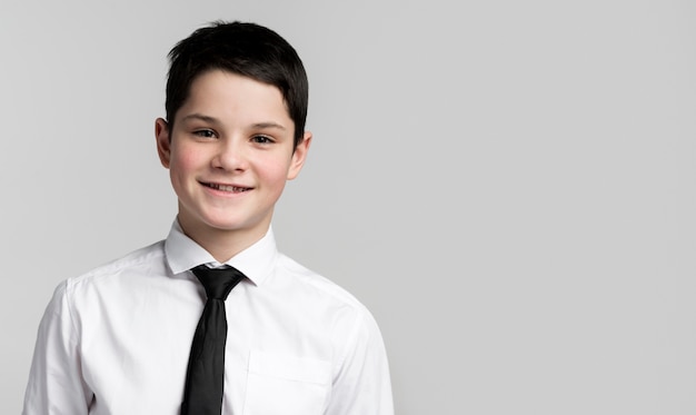 Portrait of smiley young boy posing