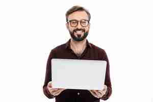 Free photo portrait of a smiling bearded man holding laptop computer
