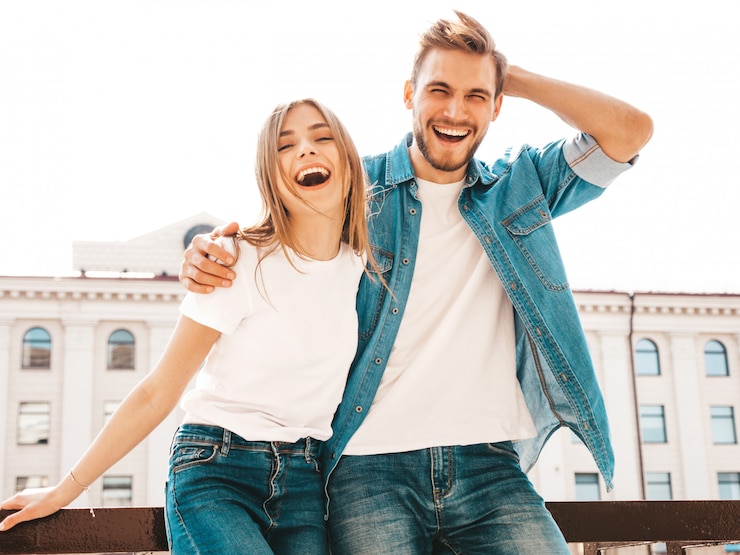 Free Photo portrait of smiling beautiful girl and her handsome boyfriend in casual summer clothes.  . hugging