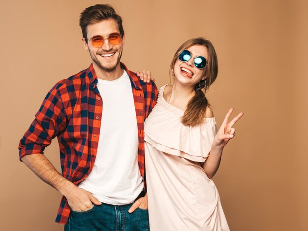 Portrait of Smiling Beautiful Girl and her Handsome Boyfriend laughing.