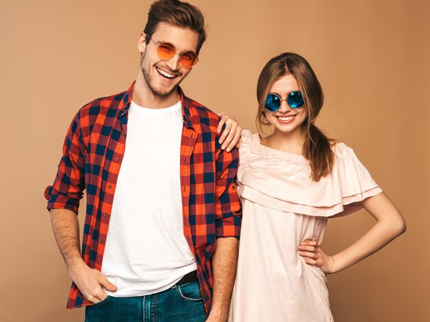 Portrait of Smiling Beautiful Girl and her Handsome Boyfriend laughing.