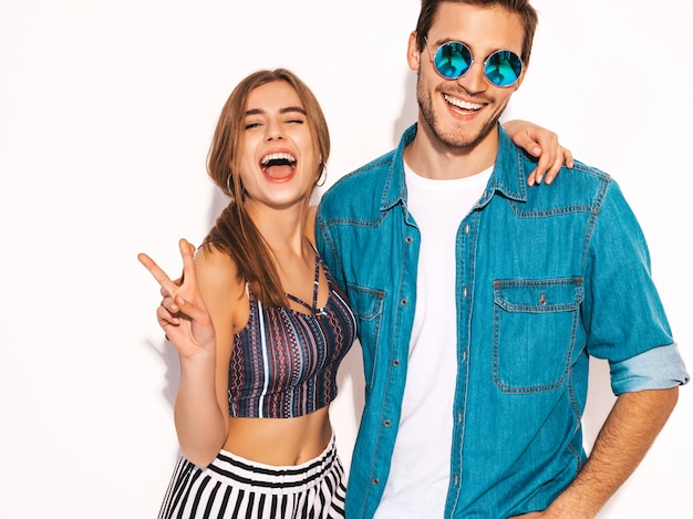 Portrait of Smiling Beautiful Girl and her Handsome Boyfriend laughing.