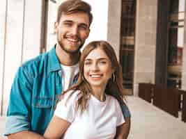 Free photo portrait of smiling beautiful girl and her handsome boyfriend. woman in casual summer jeans clothes.  . hugging