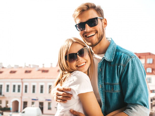 Portrait of smiling beautiful girl and her handsome boyfriend. Woman in casual summer jeans clothes.    