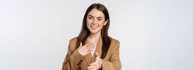 Free photo portrait of smiling businesswoman extend hand for handshake greeting business partner saleswoman wel