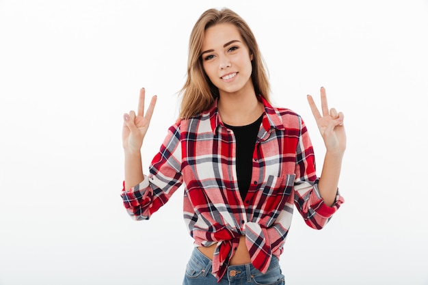 Portrait of a smiling casual girl in plaid shirt