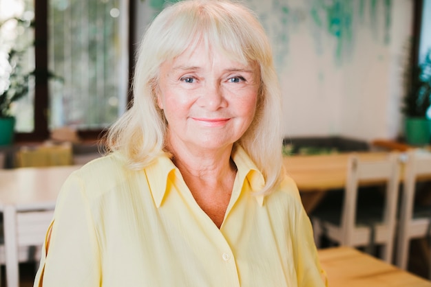 Portrait of smiling elderly gray haired woman