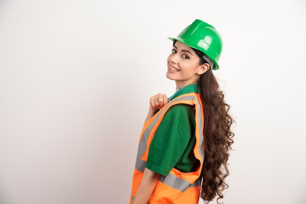 Portrait of smiling female constructor . High quality photo