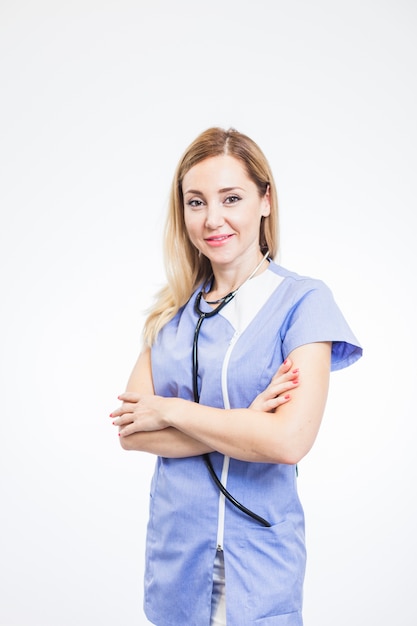 Portrait of a smiling female dentist on white background