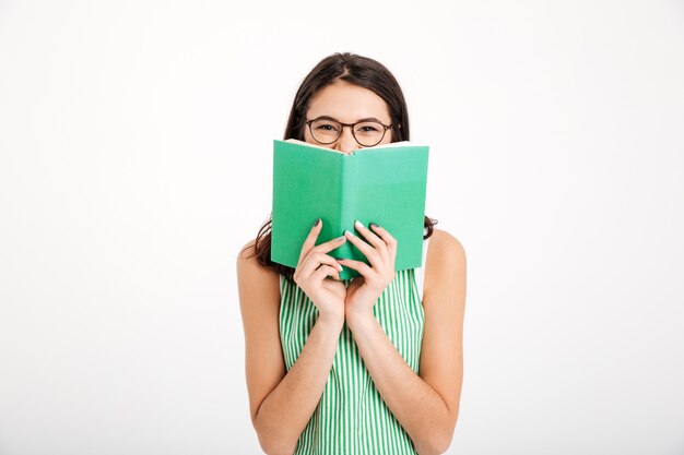 Portrait of a smiling girl in dress and eyeglasses