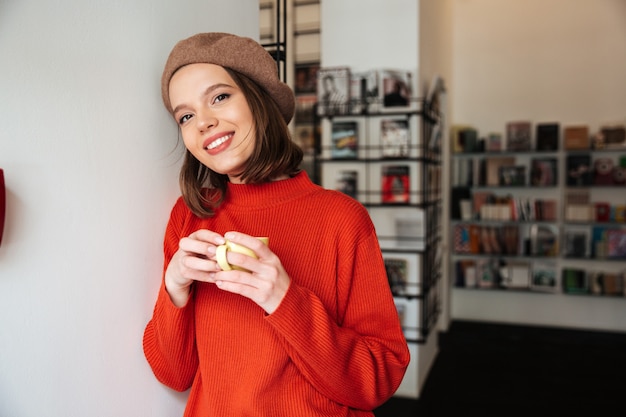 Portrait of a smiling girl dressed in sweater