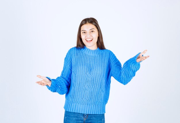 Portrait of smiling girl posing on white.