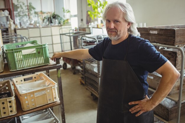 Portrait of smiling glassblower