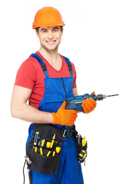 Portrait of smiling handyman with tools isolated on white