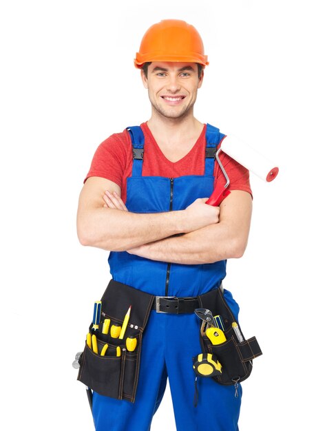 Portrait of smiling handyman with tools isolated on white