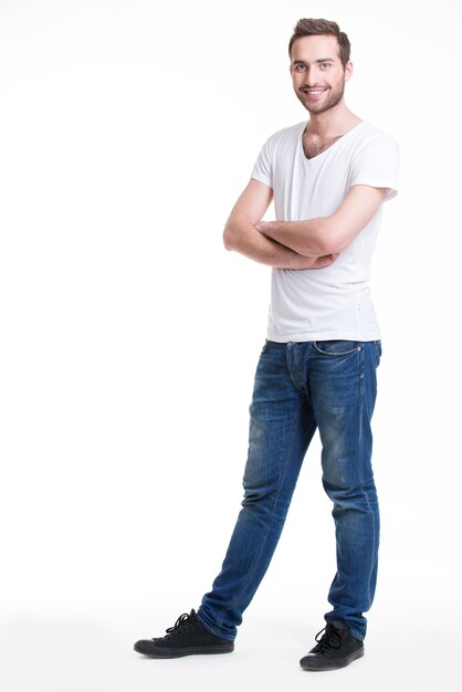 Portrait of smiling happy man in casuals in full growth - isolated on white
