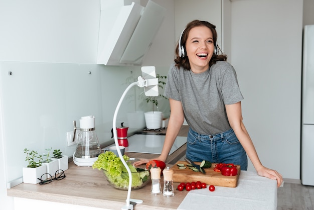 Portrait of a smiling happy woman listening to music