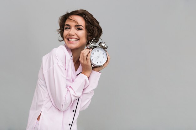 Portrait of a smiling happy woman in pajamas