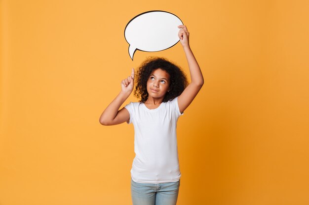 Portrait of a smiling little african girl with speech bubble