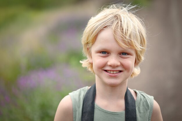 Portrait of a smiling little caucasian blond boy