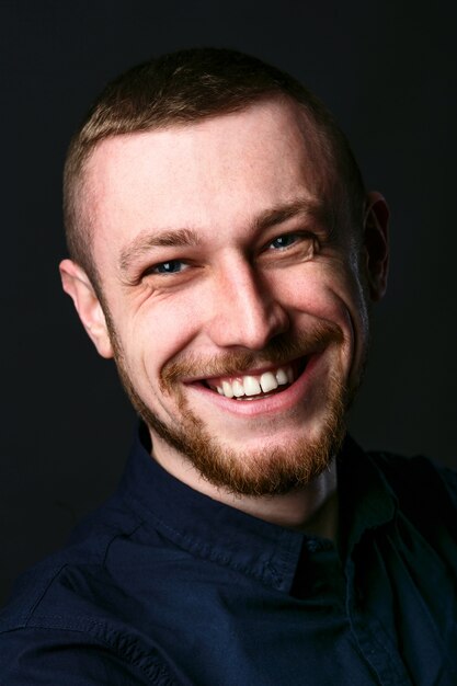 Portrait of smiling man with deep blue eyes 