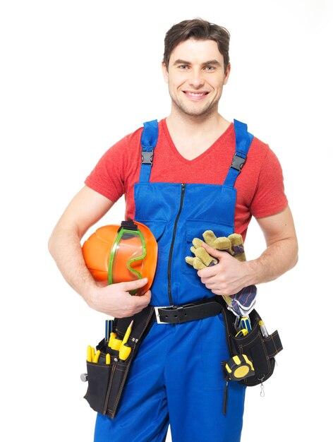 Portrait of smiling manual worker with tools isolated on white