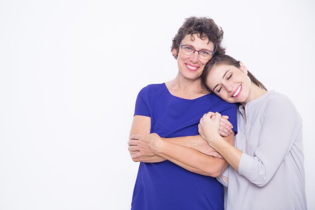 Portrait of smiling senior mother and her daughter