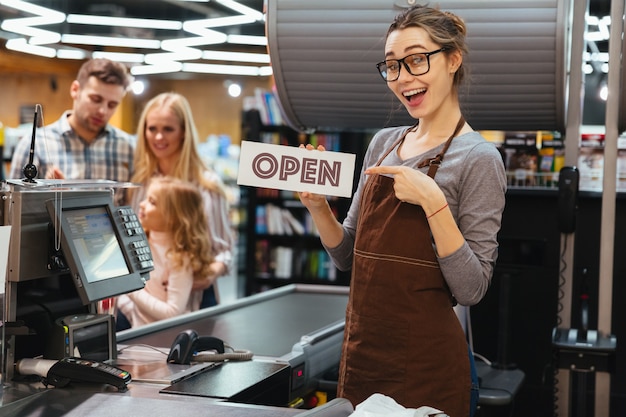 Portrait of smiling woman cashier