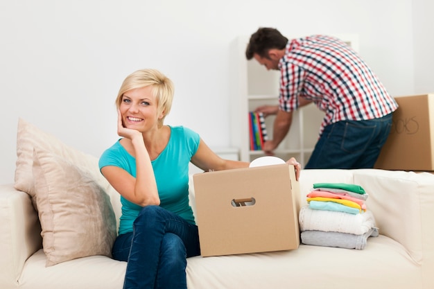 Portrait of smiling woman during the decorating new living room